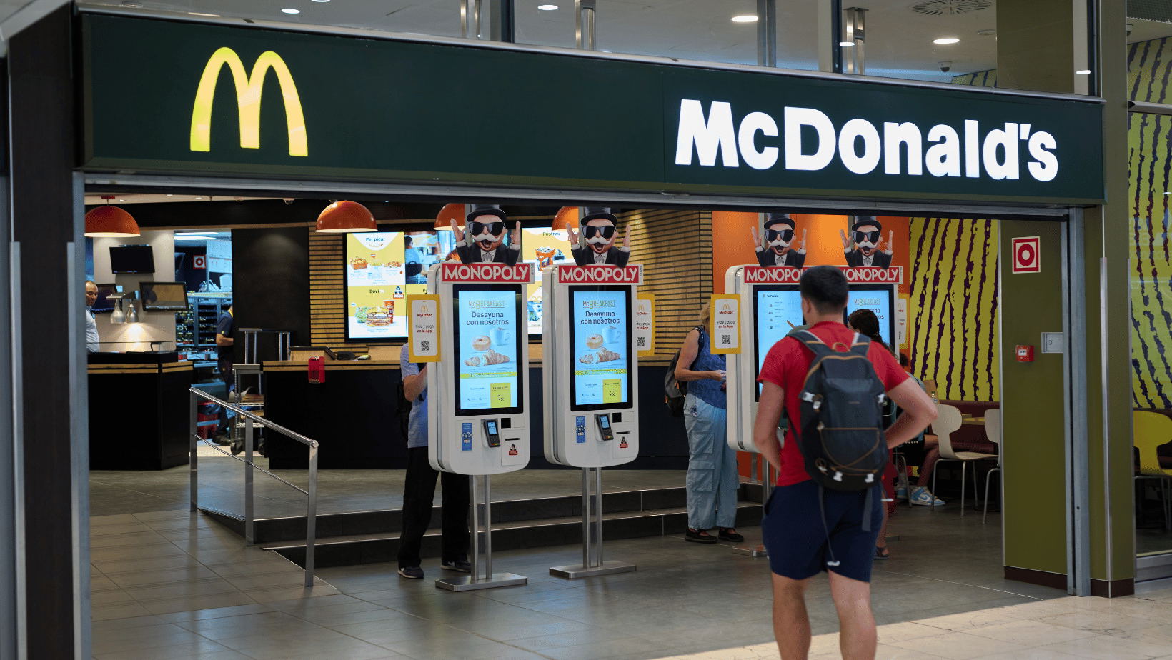 McDonald's entrance with self-serve kiosks to order