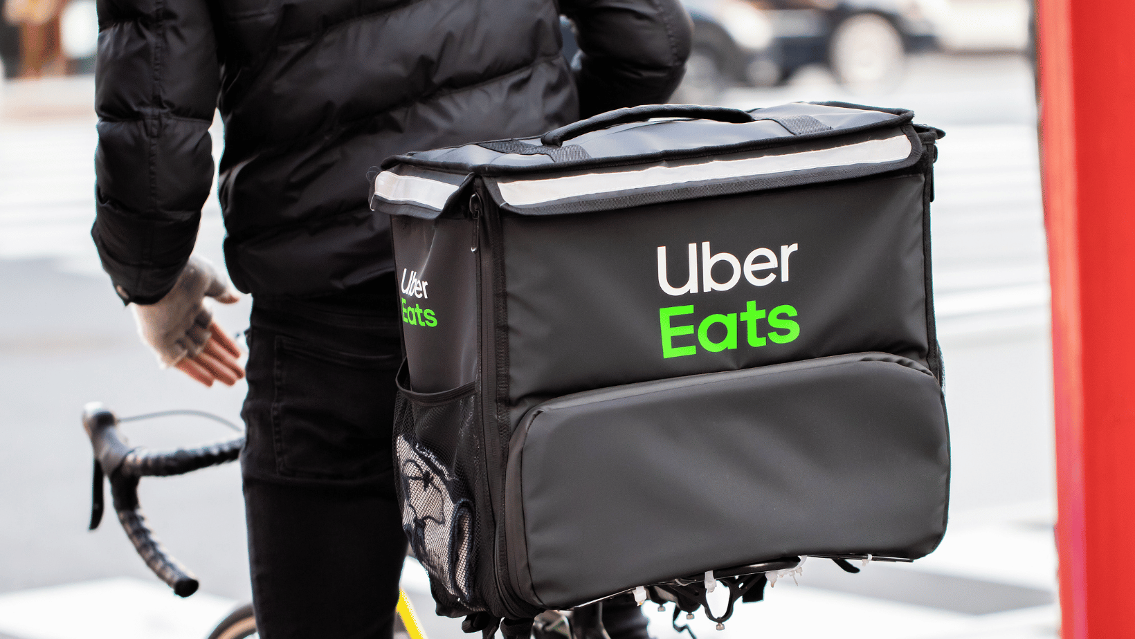 UberEats courier delivering by bicycle.