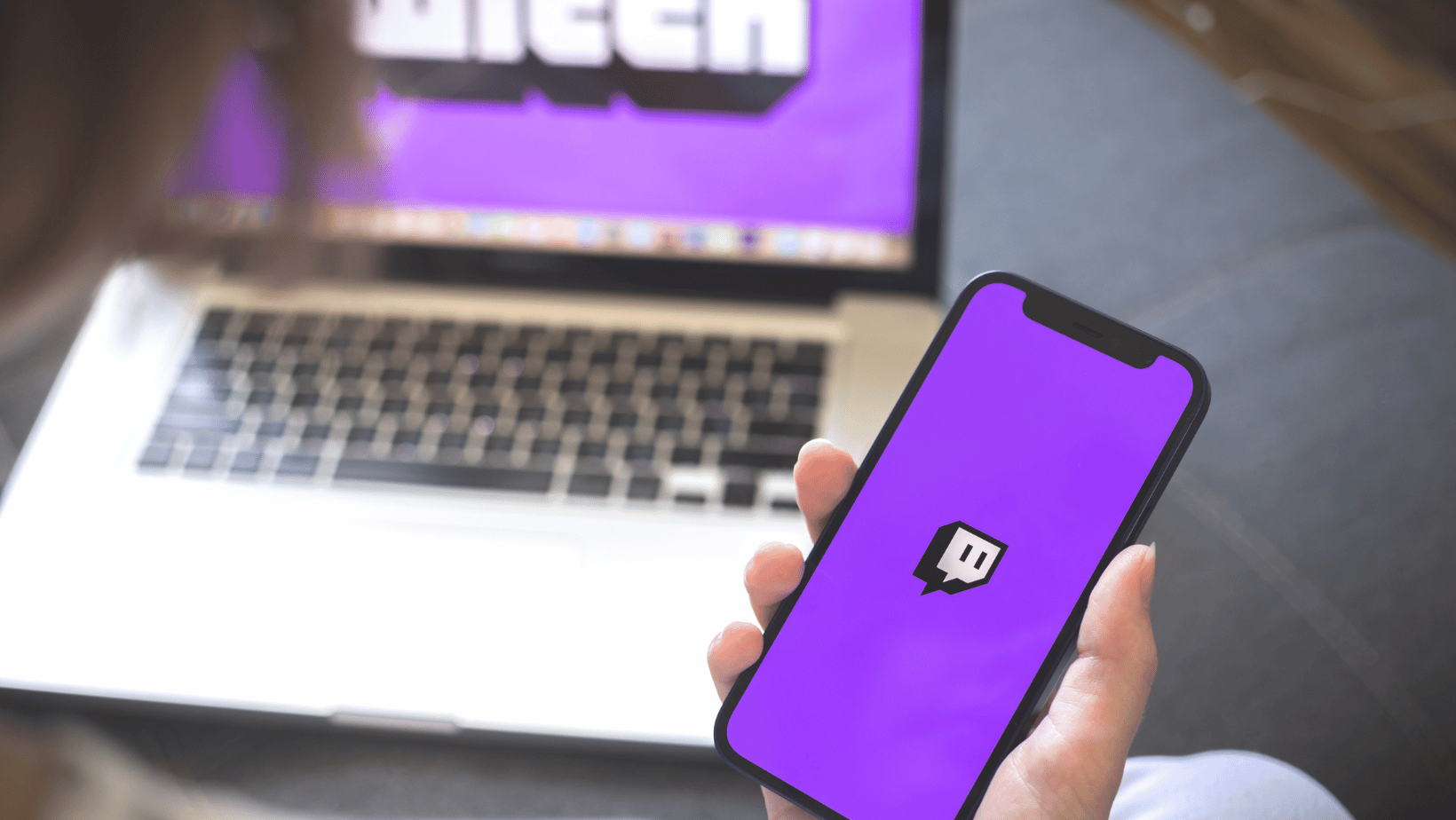 Woman using smartphone with twitch application