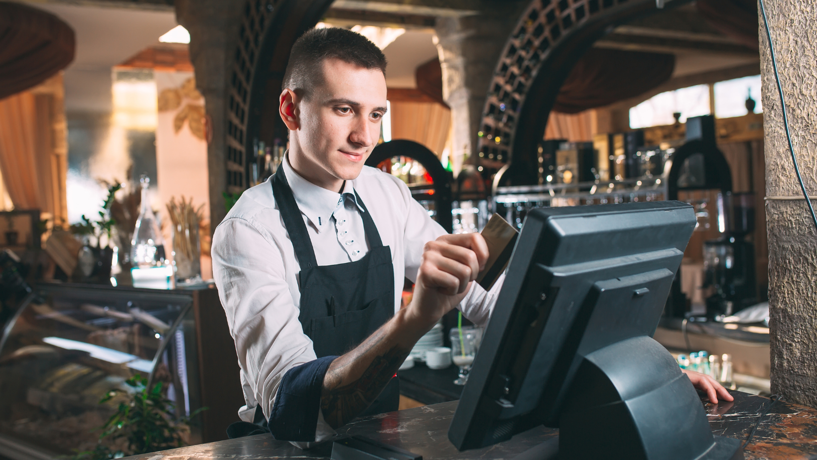 Server using restaurant POS system to take an order. 