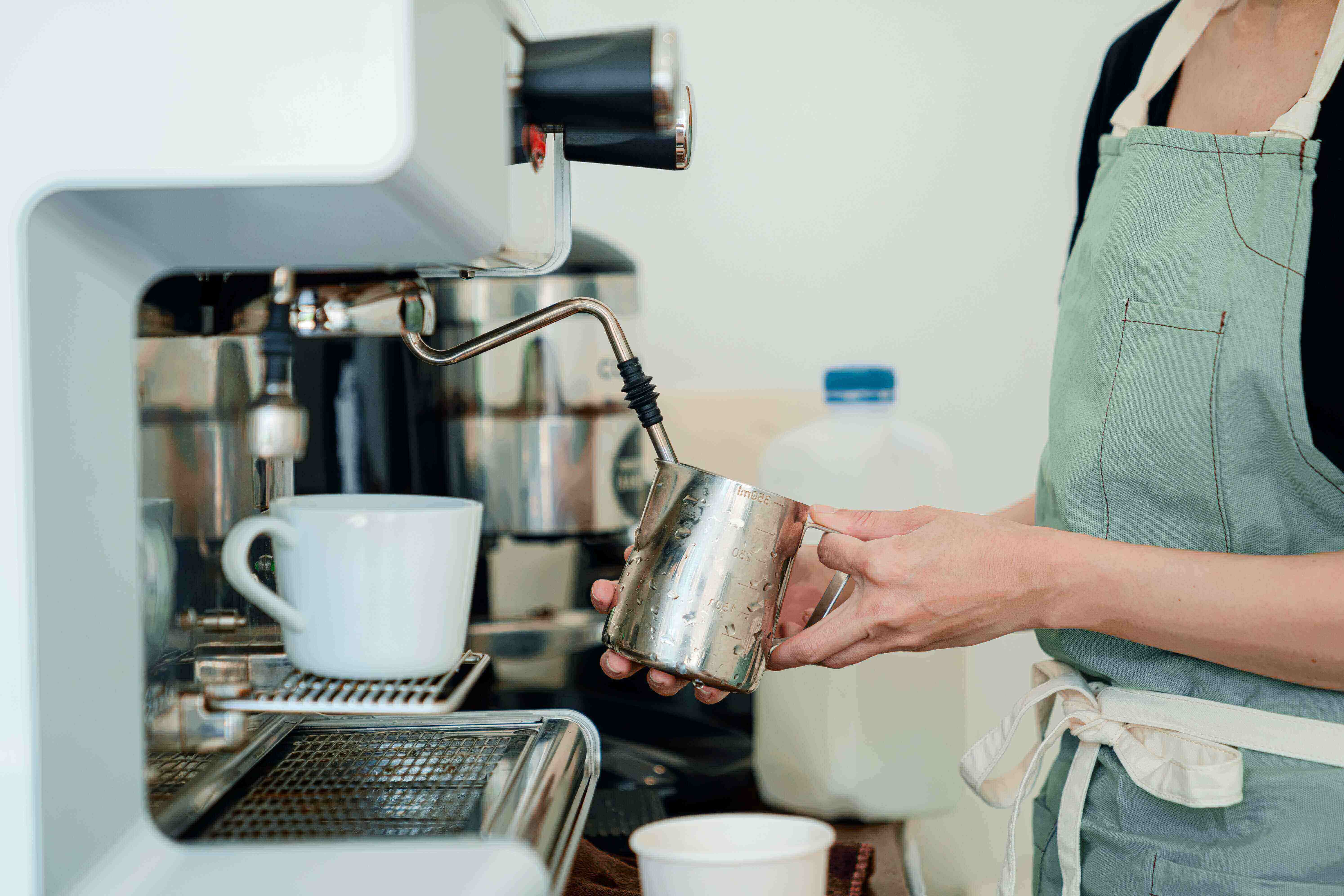 A person making an espresso