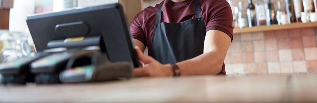 A man entering an ordering into the POS